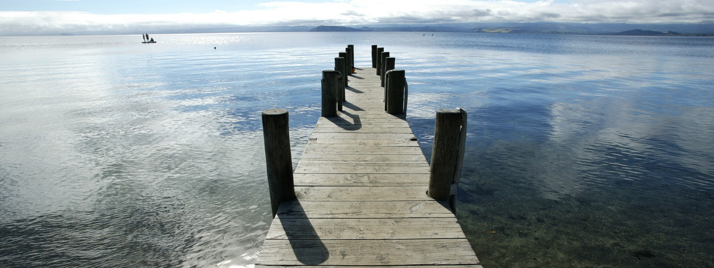 A wharf situated in the calm waters of Lake Taupo.