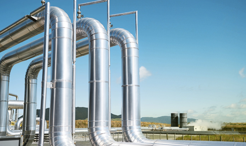 A photograph of pipes at a geothermal power station.