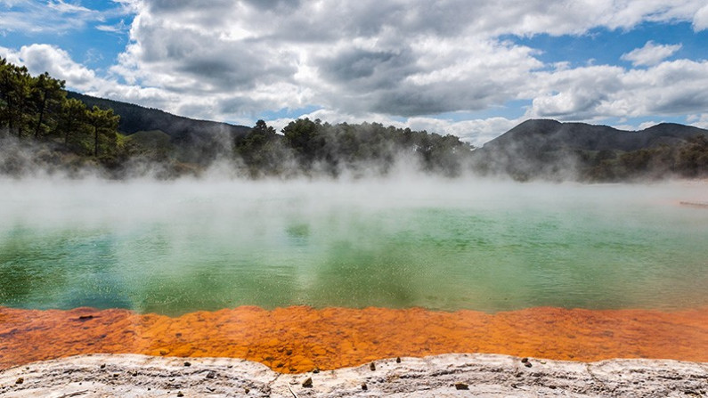 Colourful steaming geothermal pool.