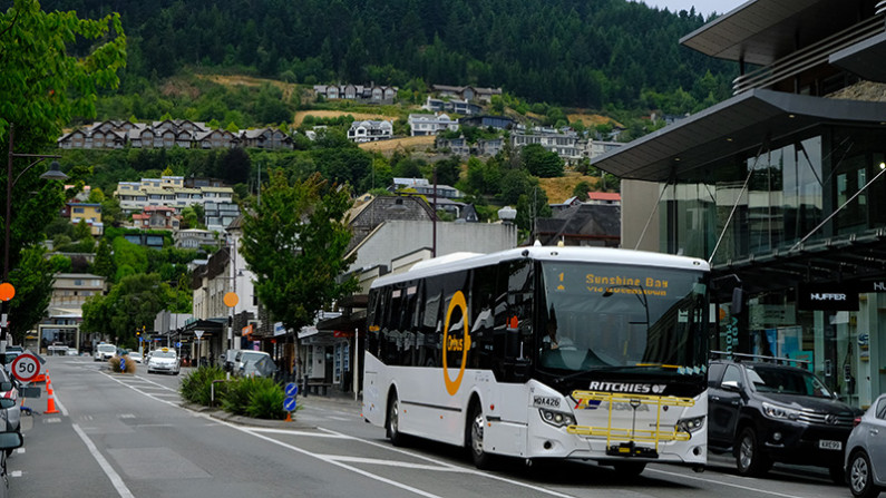 A bus travelling through the centre of Queenstown