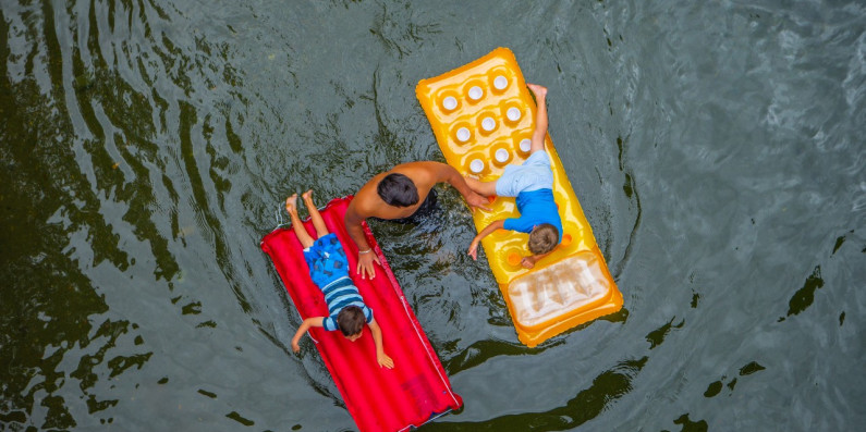 Kids on a floating lilo at Kaitoke, Wellington