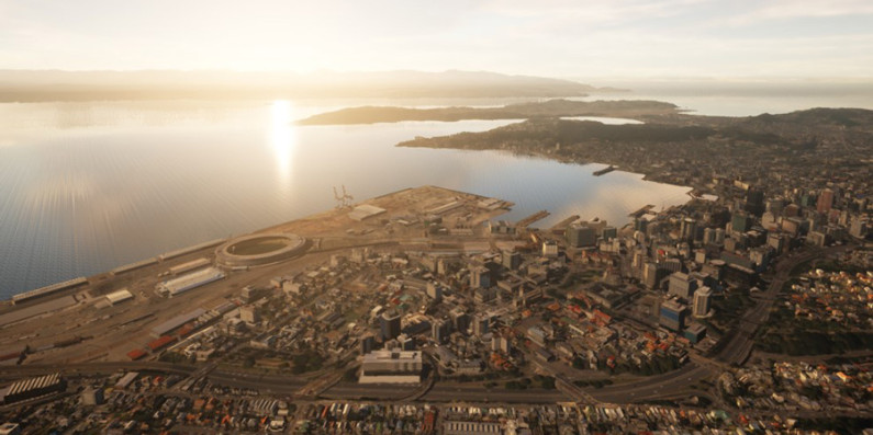 An aerial view of Wellington city showing the harbour, stadium and central city.