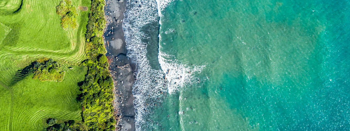 Overhead view of a beach shore and land