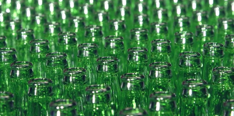 Rows of green glass bottles.